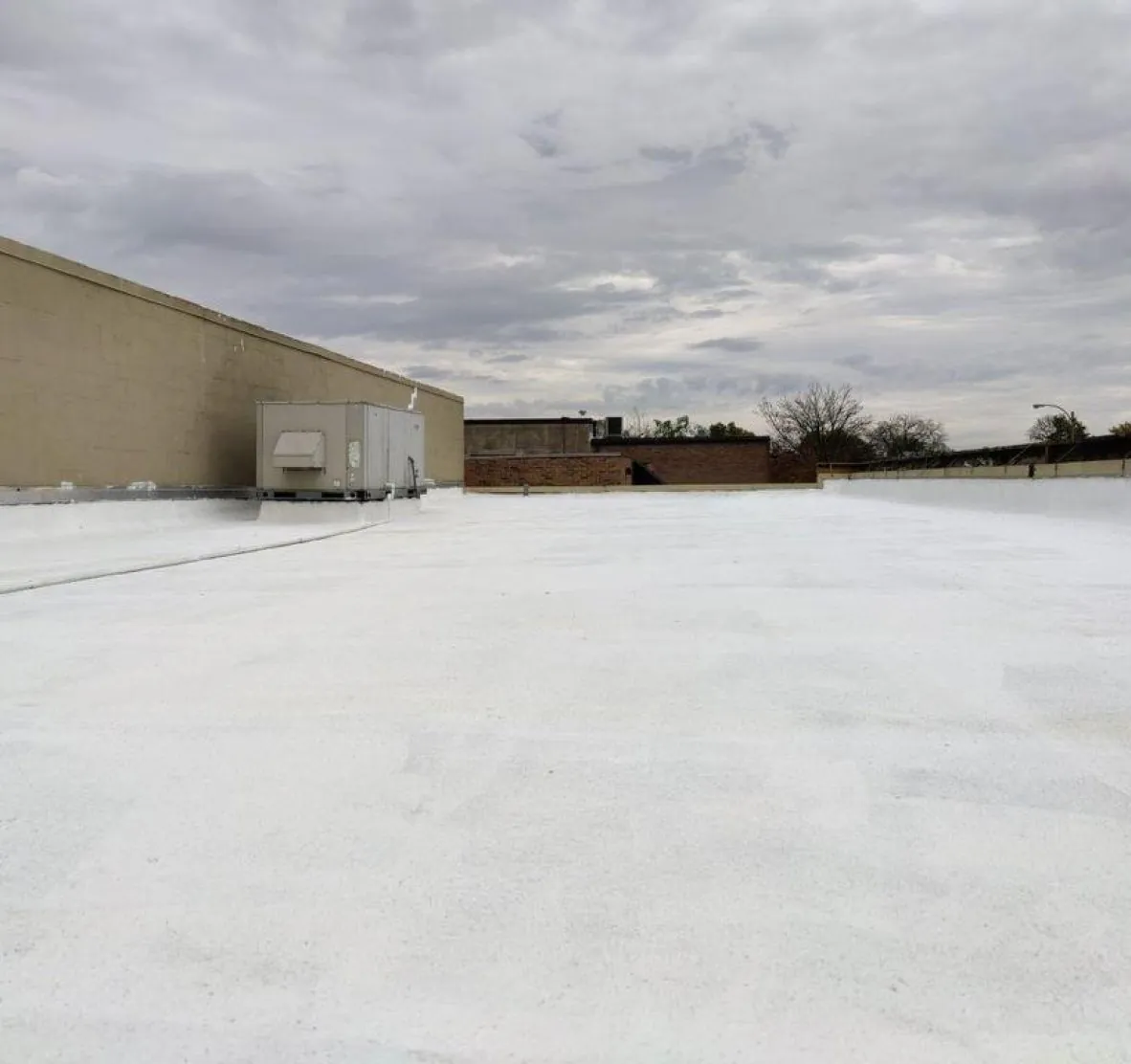 Aerial view of a flat roof repair and maintenance project in St. Louis — Brandon J Roofing