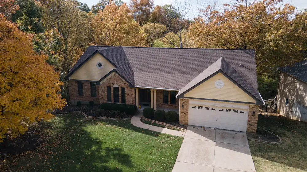 roofing contractors working on residential house in st peters mo